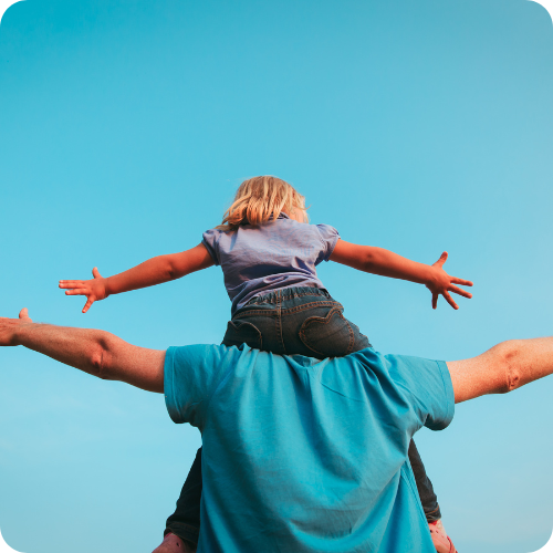 A child sitting on a man's shoulders, symbolising the support and elevation ARKK provides.