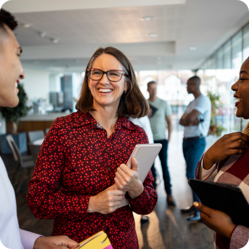 A smiling woman at the office, reflecting the positive culture at ARKK.